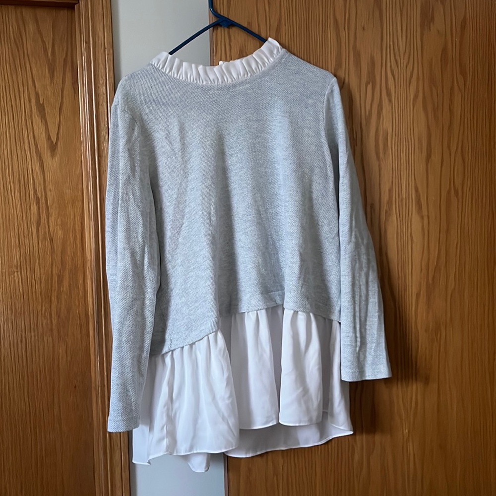 Grey collared sweater.
